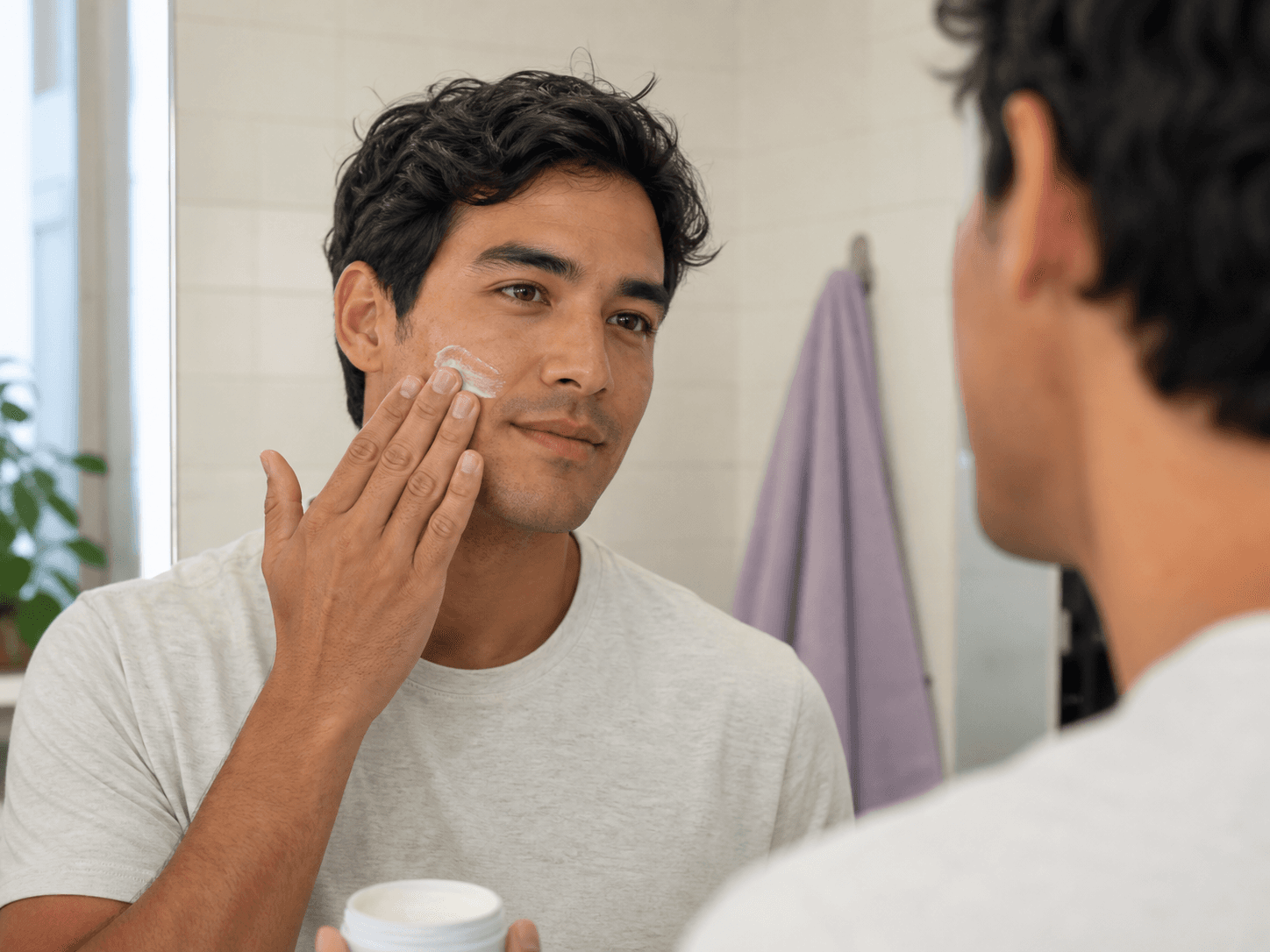 Man following his personalised skincare routine