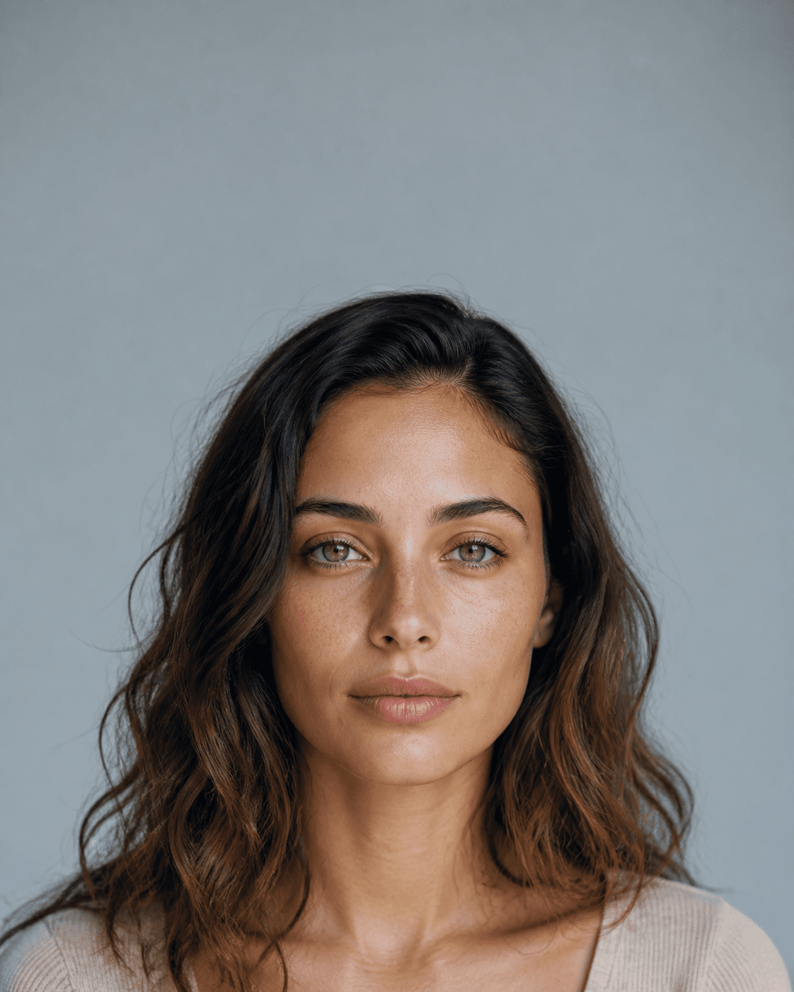 Editorial close-up portrait showing natural skin texture